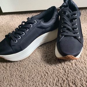 black platform sneakers by Steve Madden
